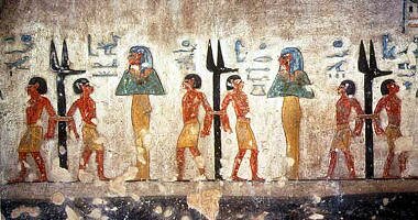 The jackal-headed stakes of Geb, with two enemies bound to each (tomb of Ramesses III).